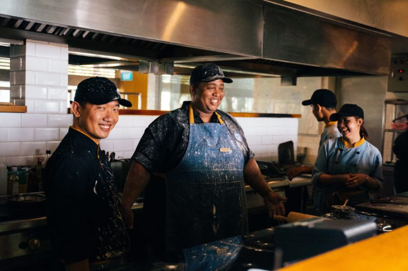 Restaurant kitchen team working during food service
